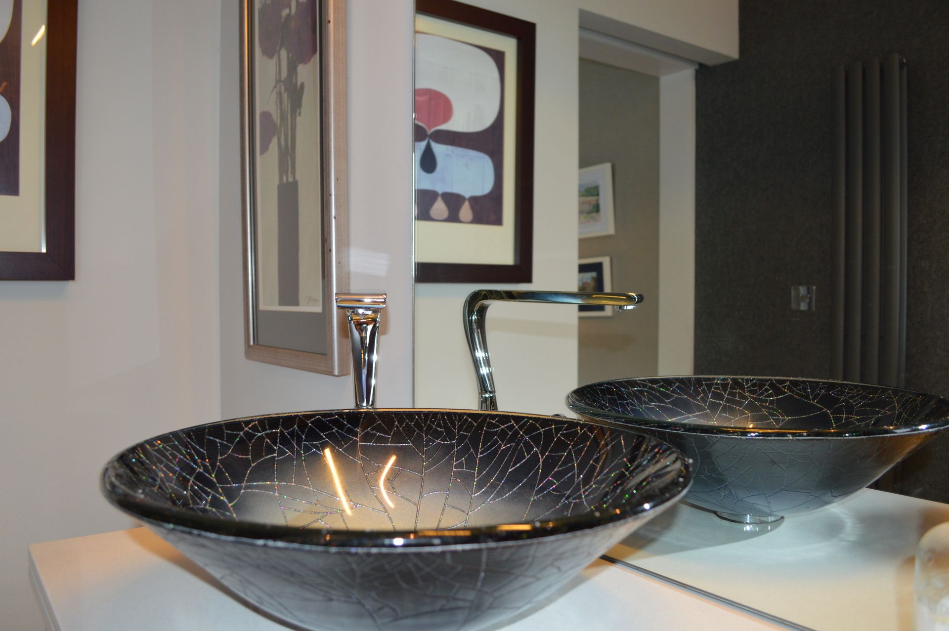 A bathroom with two sinks and a mirror