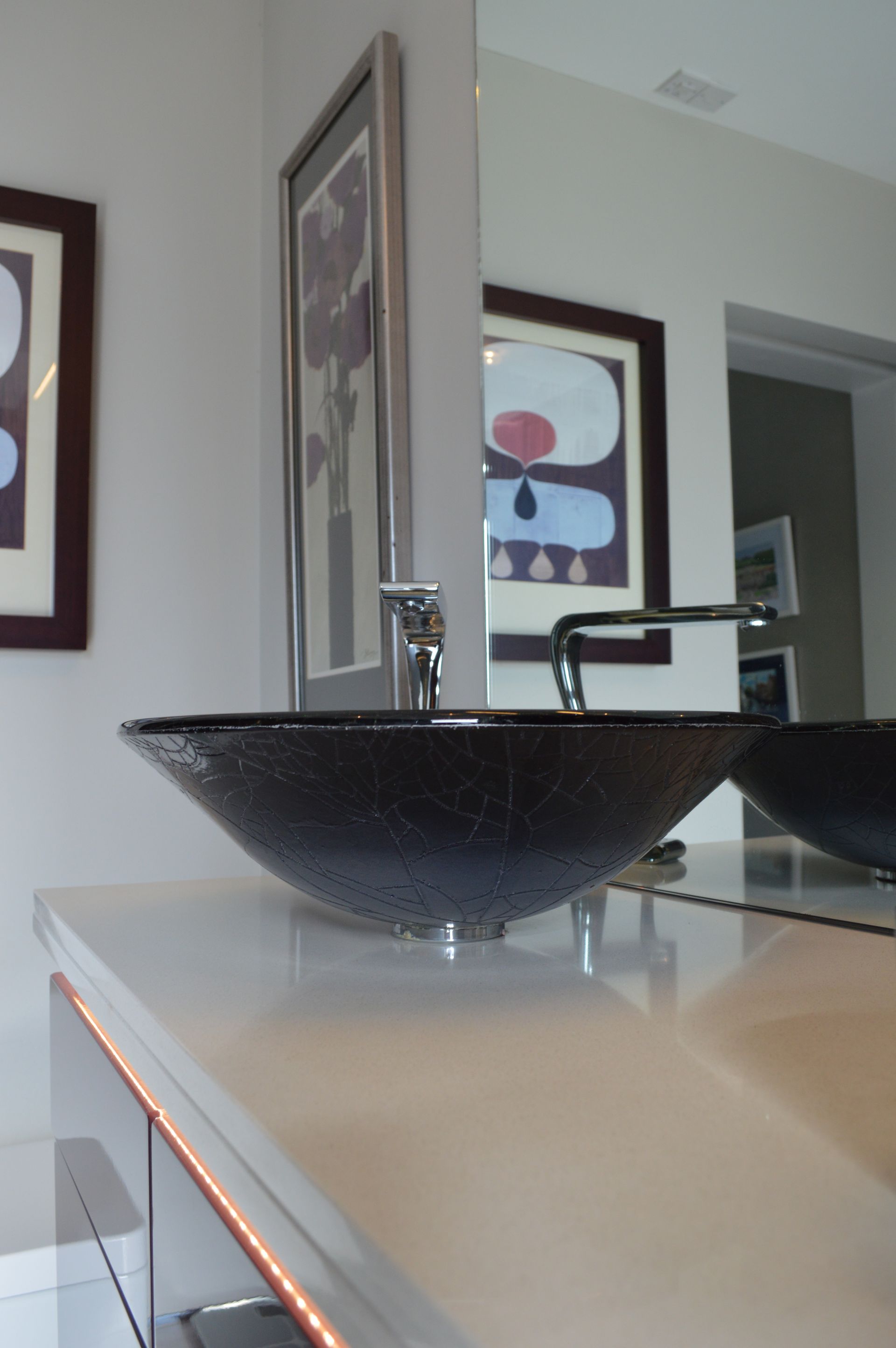 A bathroom with two sinks and a mirror