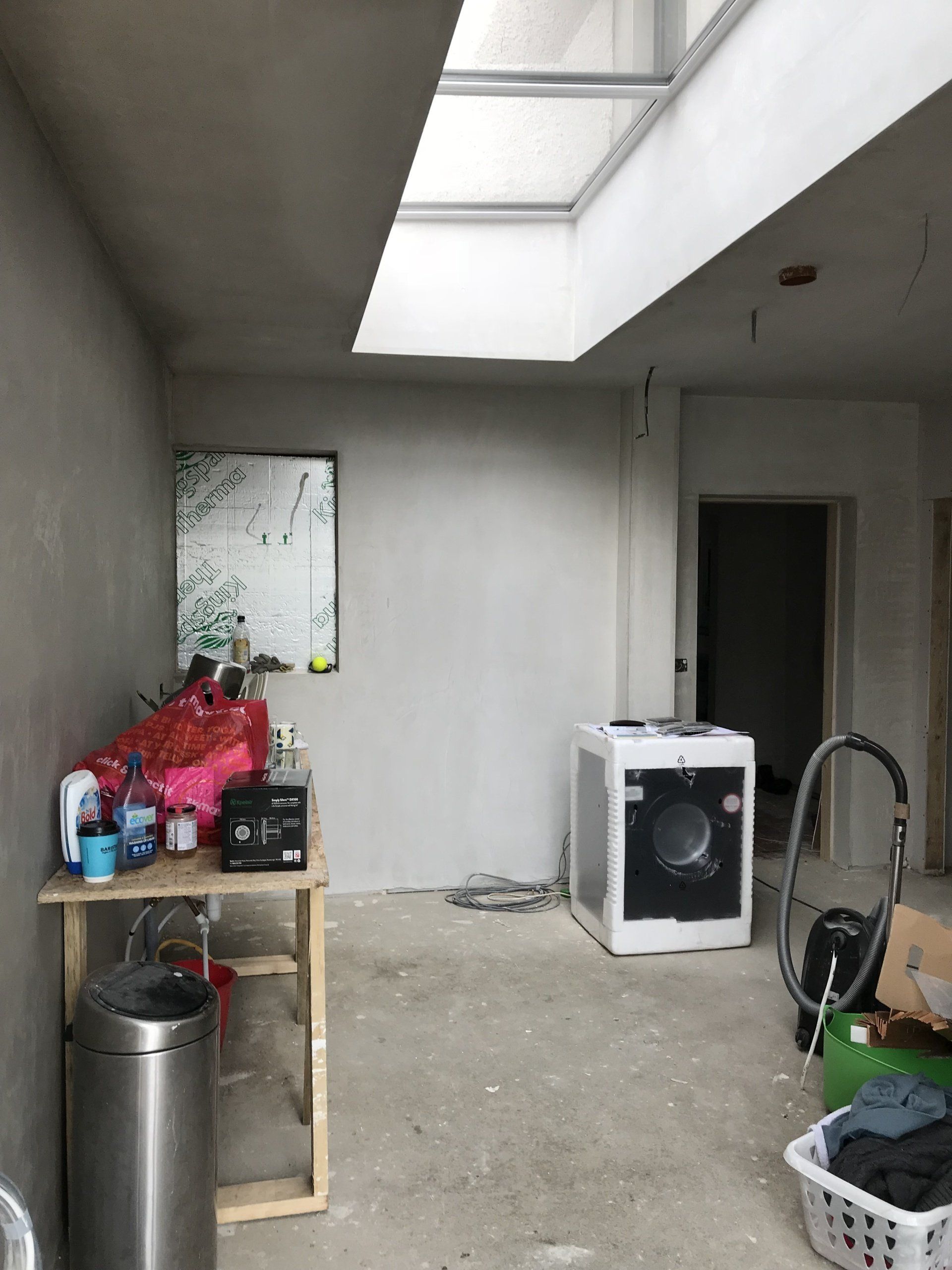 A room with a washer and dryer in it