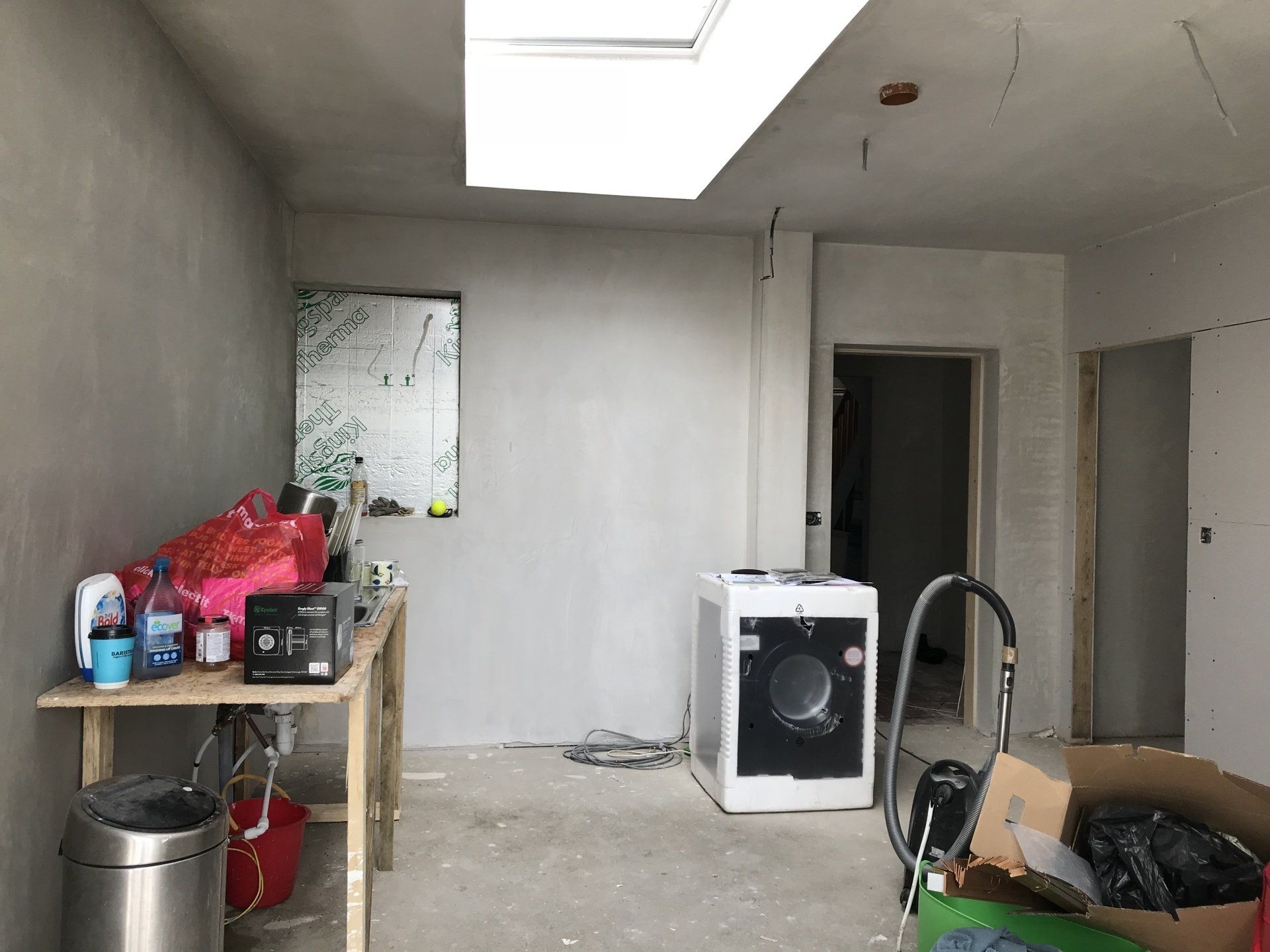 A room with a washer and dryer in it