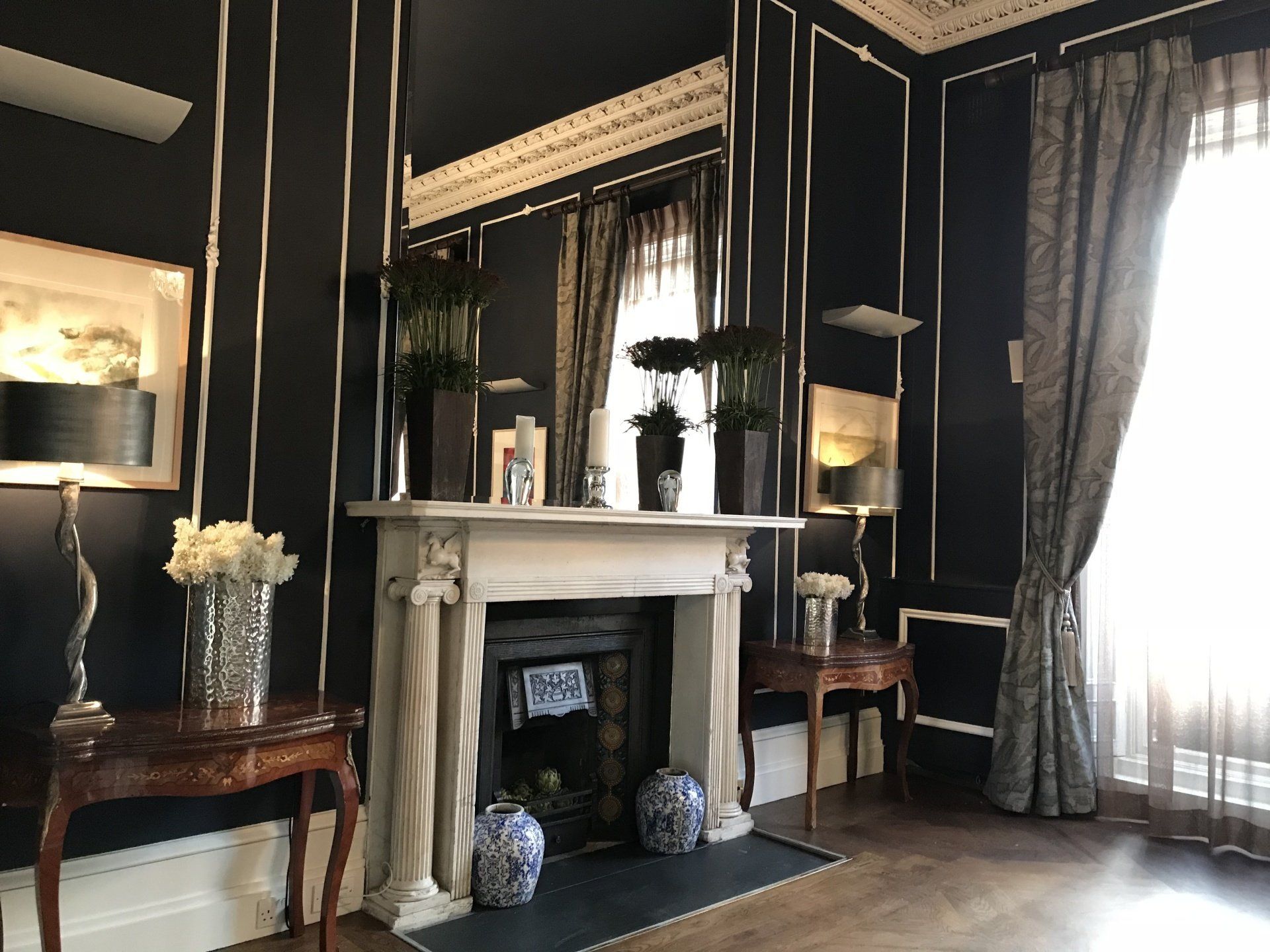 There is a fireplace in the middle of the room.