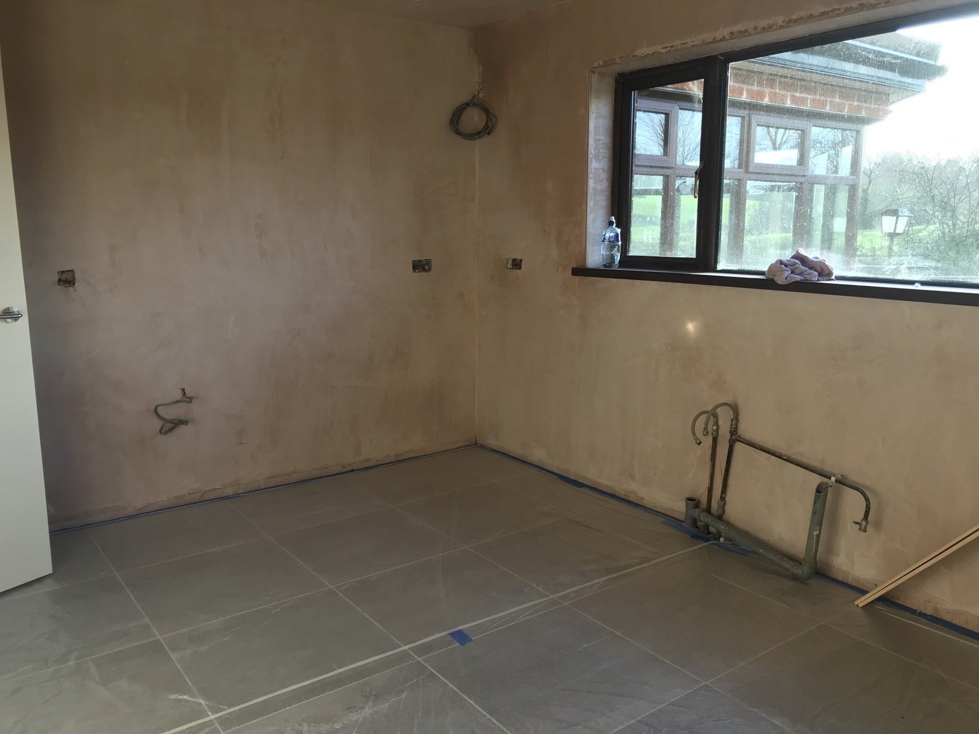 There is a window in the corner of the room.