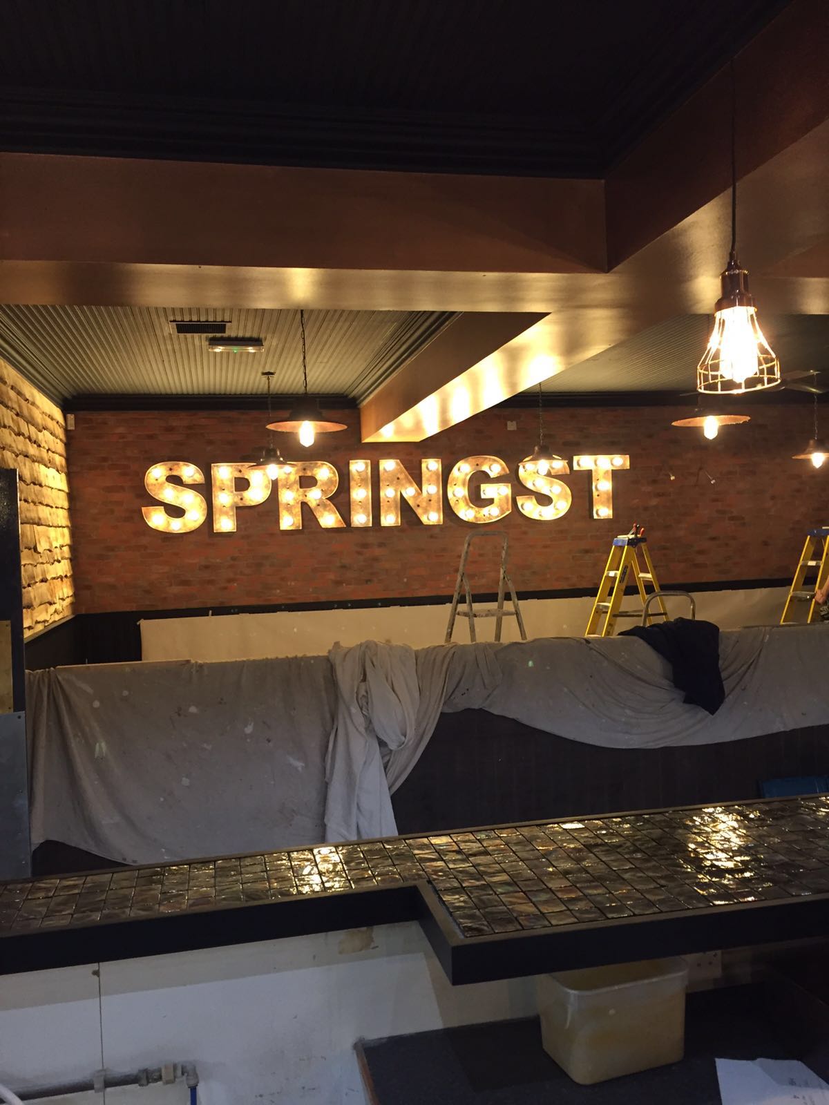 A brick wall with the word springst on it