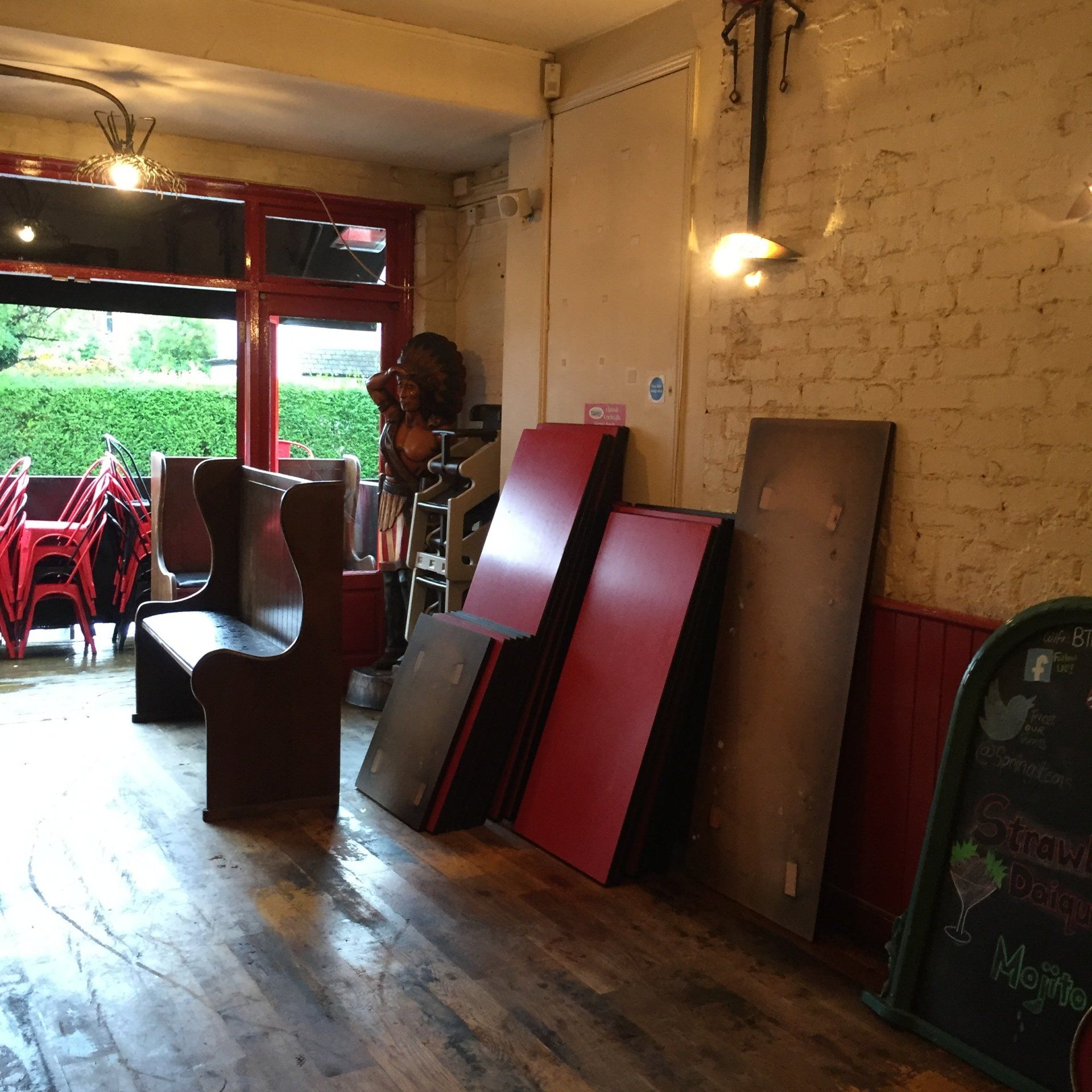 A room with a chalkboard that says ' menu ' on it