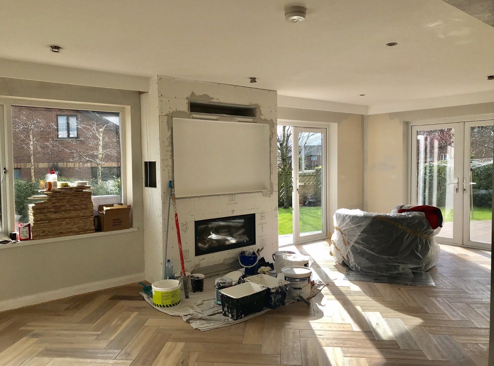 A living room with a fireplace and a couch in it.