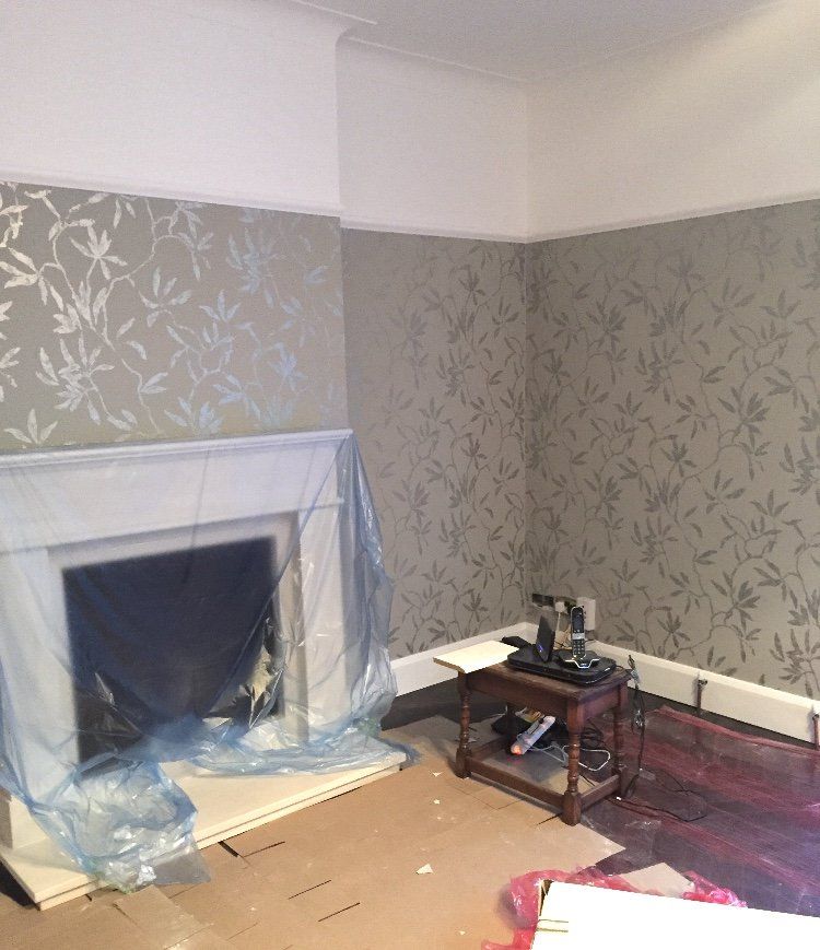 A living room with a fireplace and a table in it