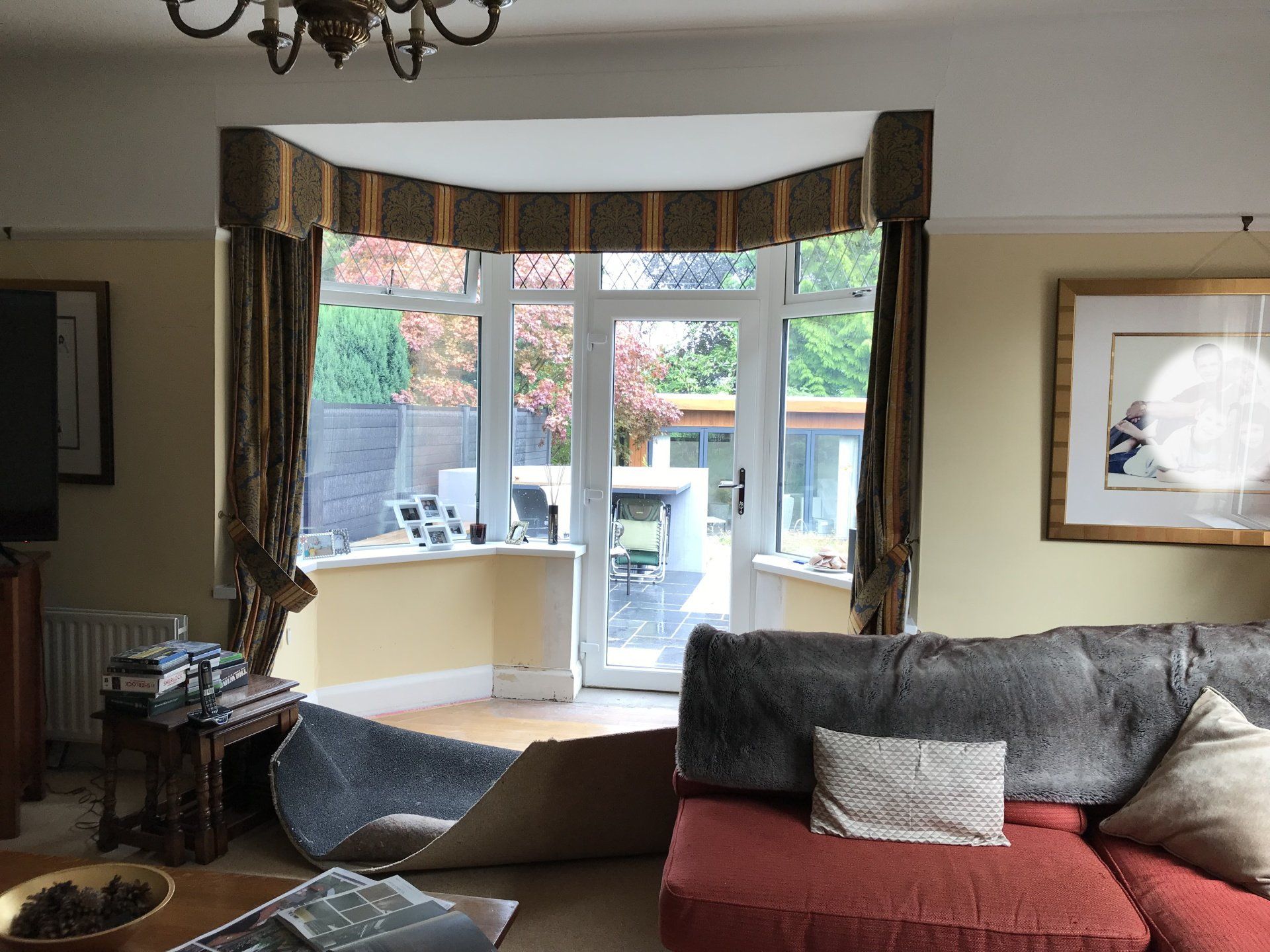 A living room with a couch and a large window