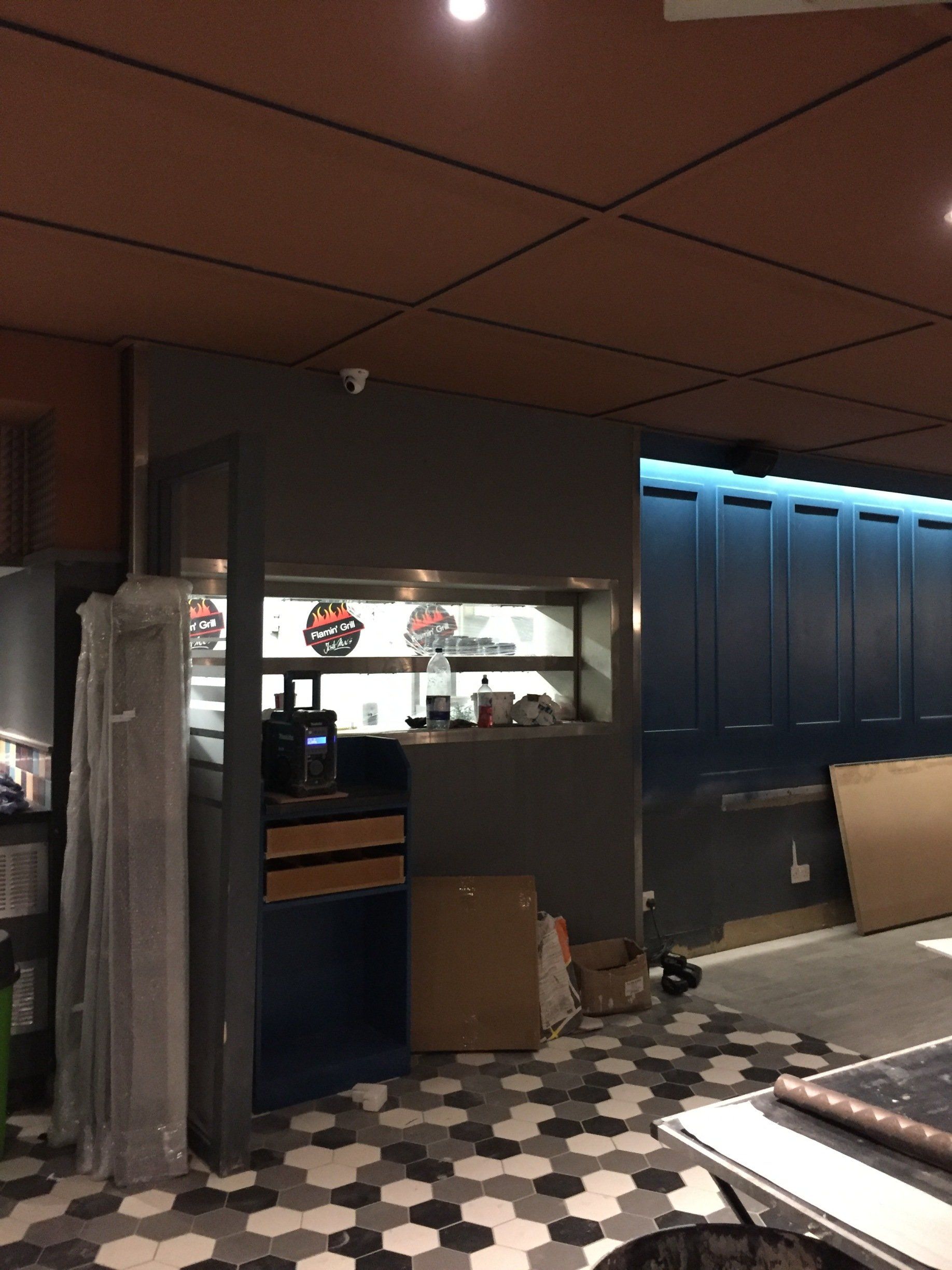 A room with a checkered floor and a ceiling.