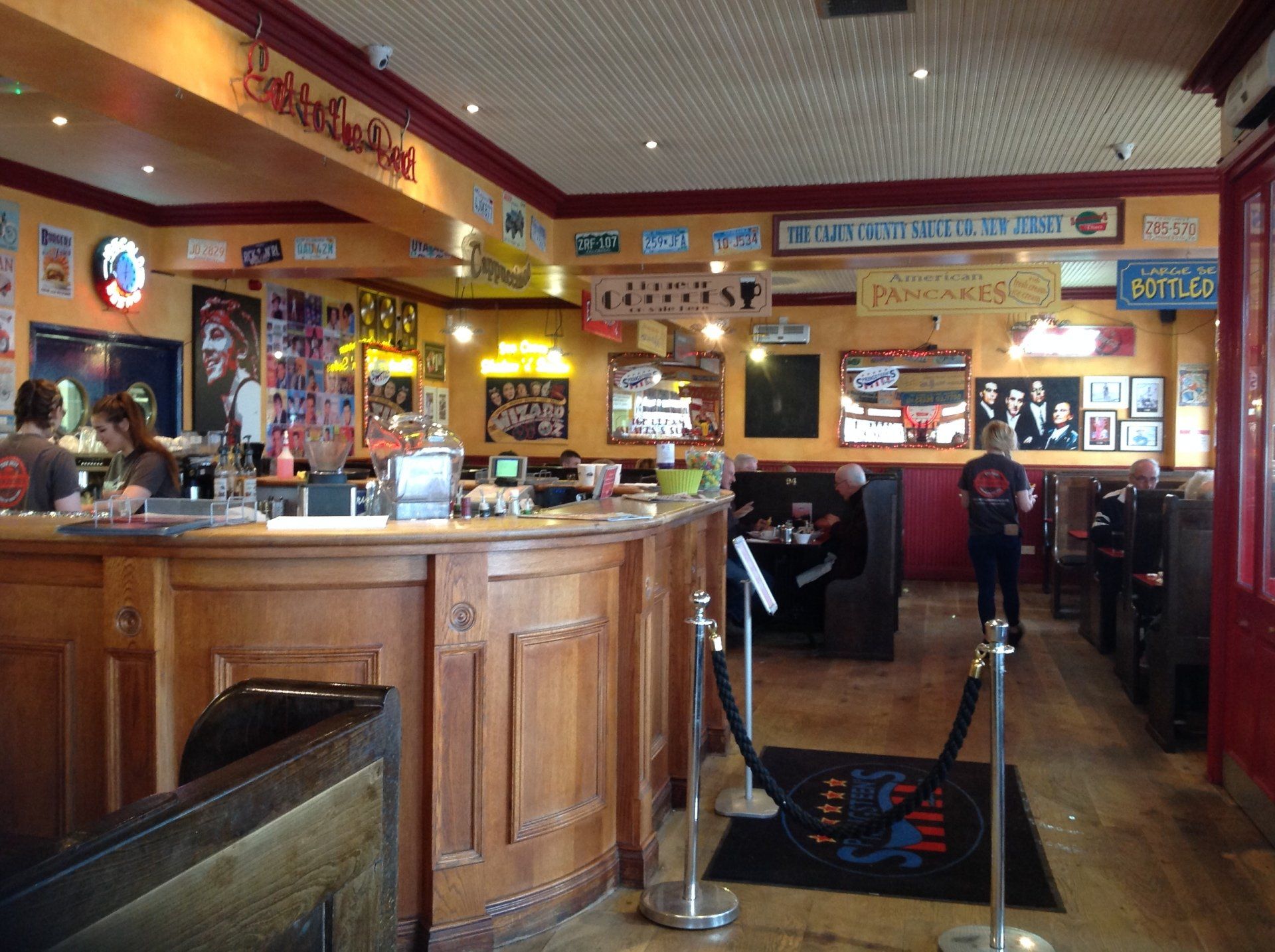 The inside of a restaurant with people sitting at tables