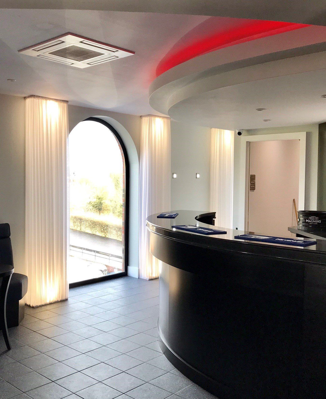 A room with a round counter and a window