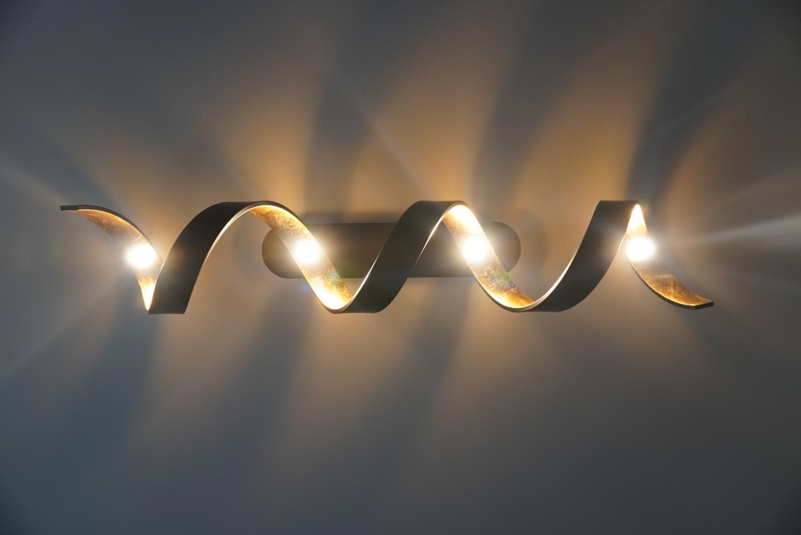 A light that looks like a spiral is on a wall