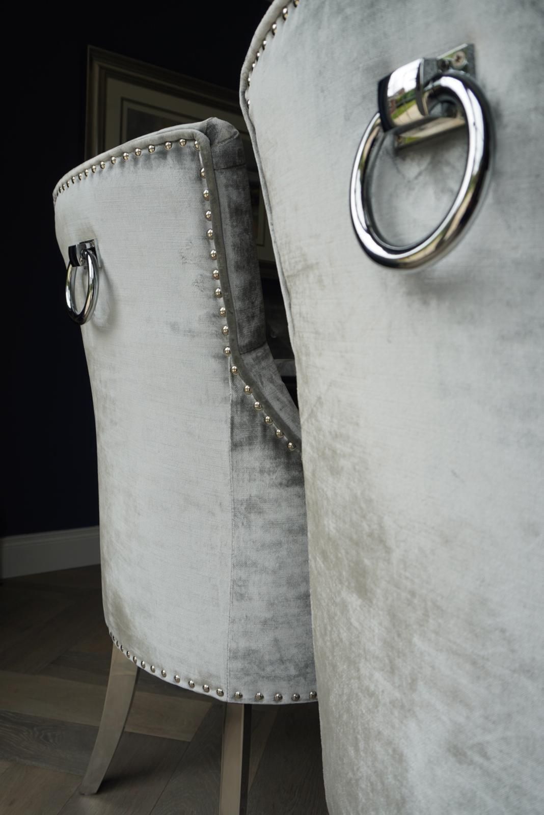 A close up of a chair with a metal ring on the back