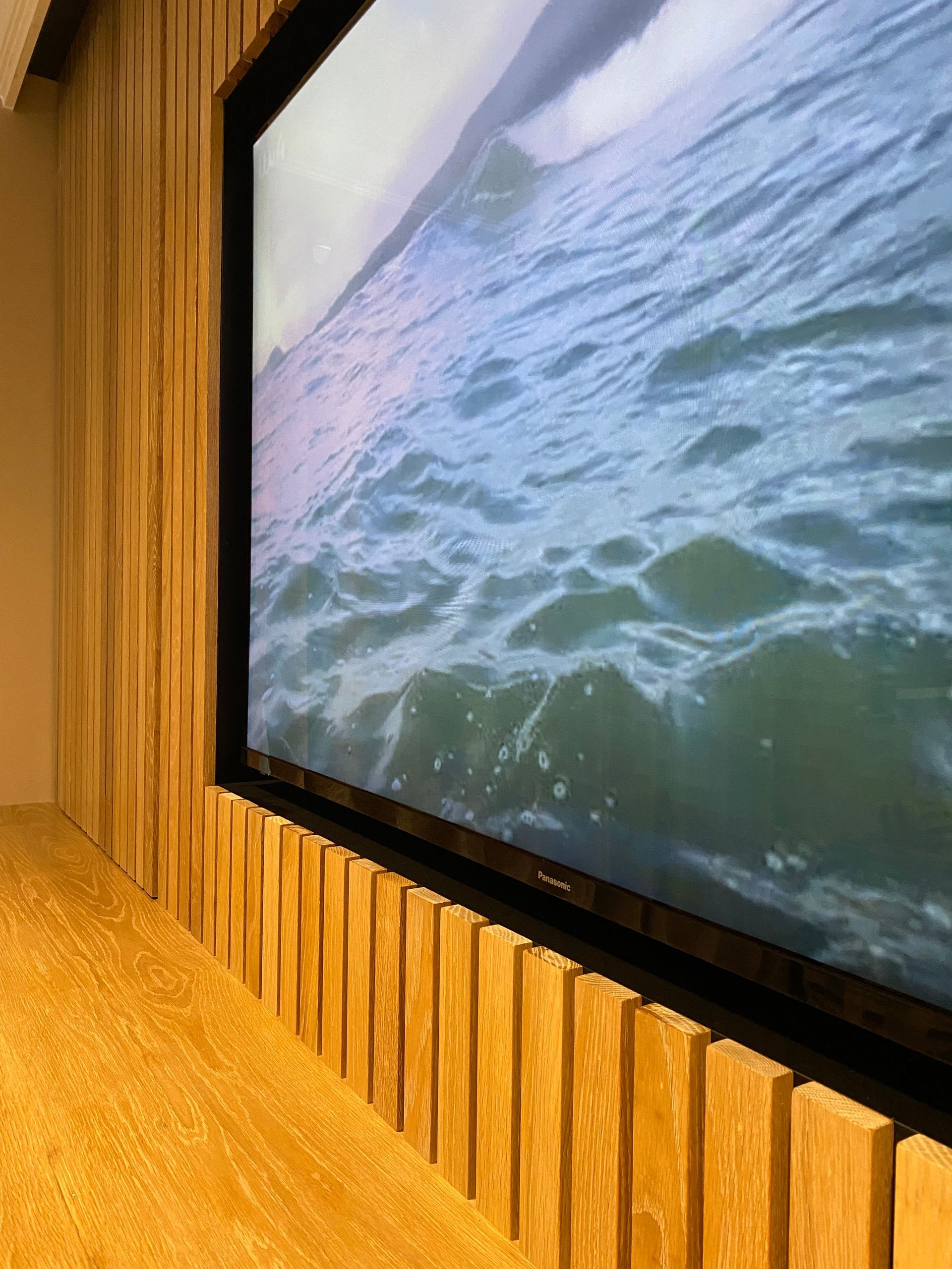 A large screen with a picture of the ocean on it