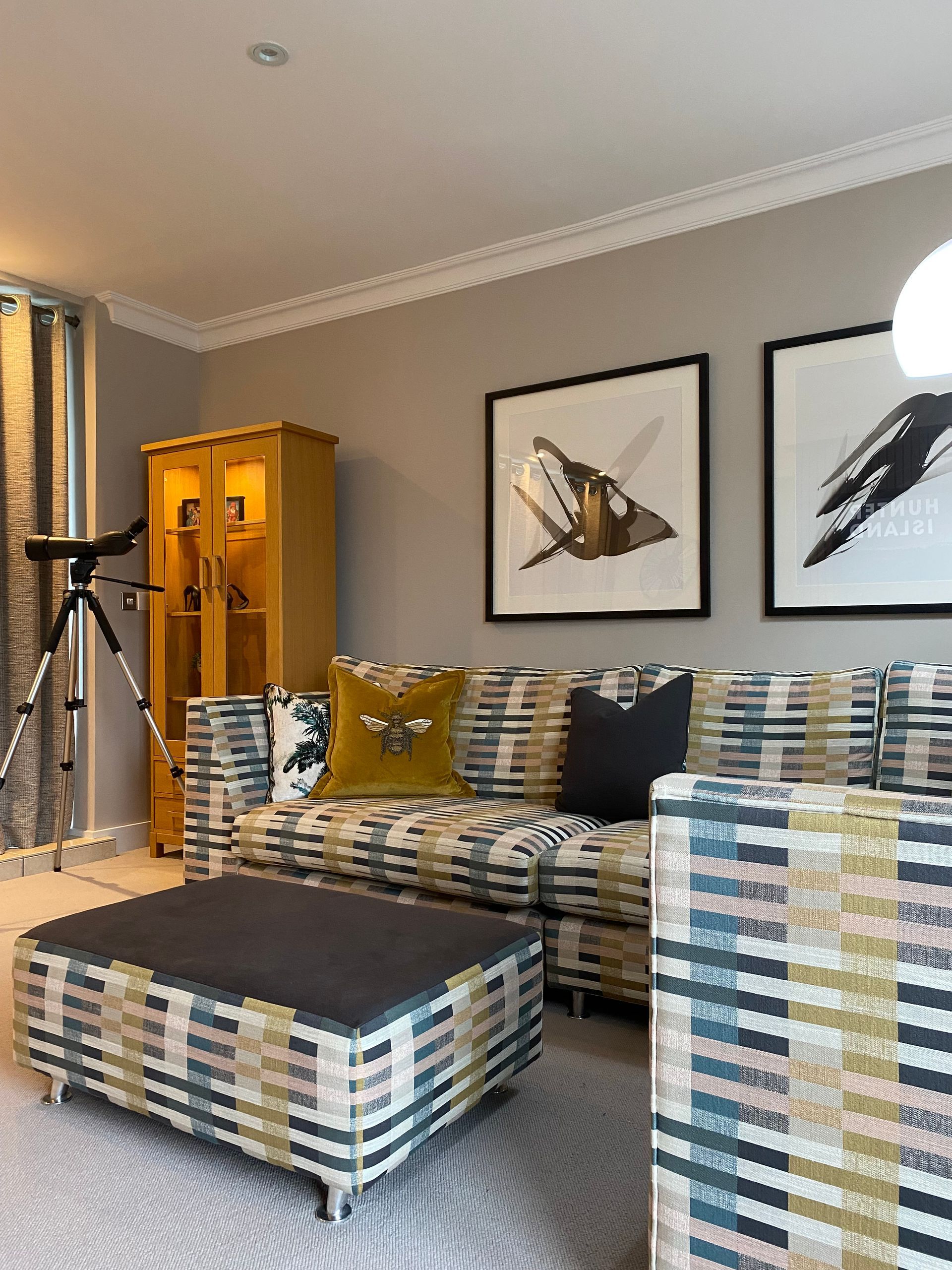 A living room with a couch , chairs , and a coffee table.