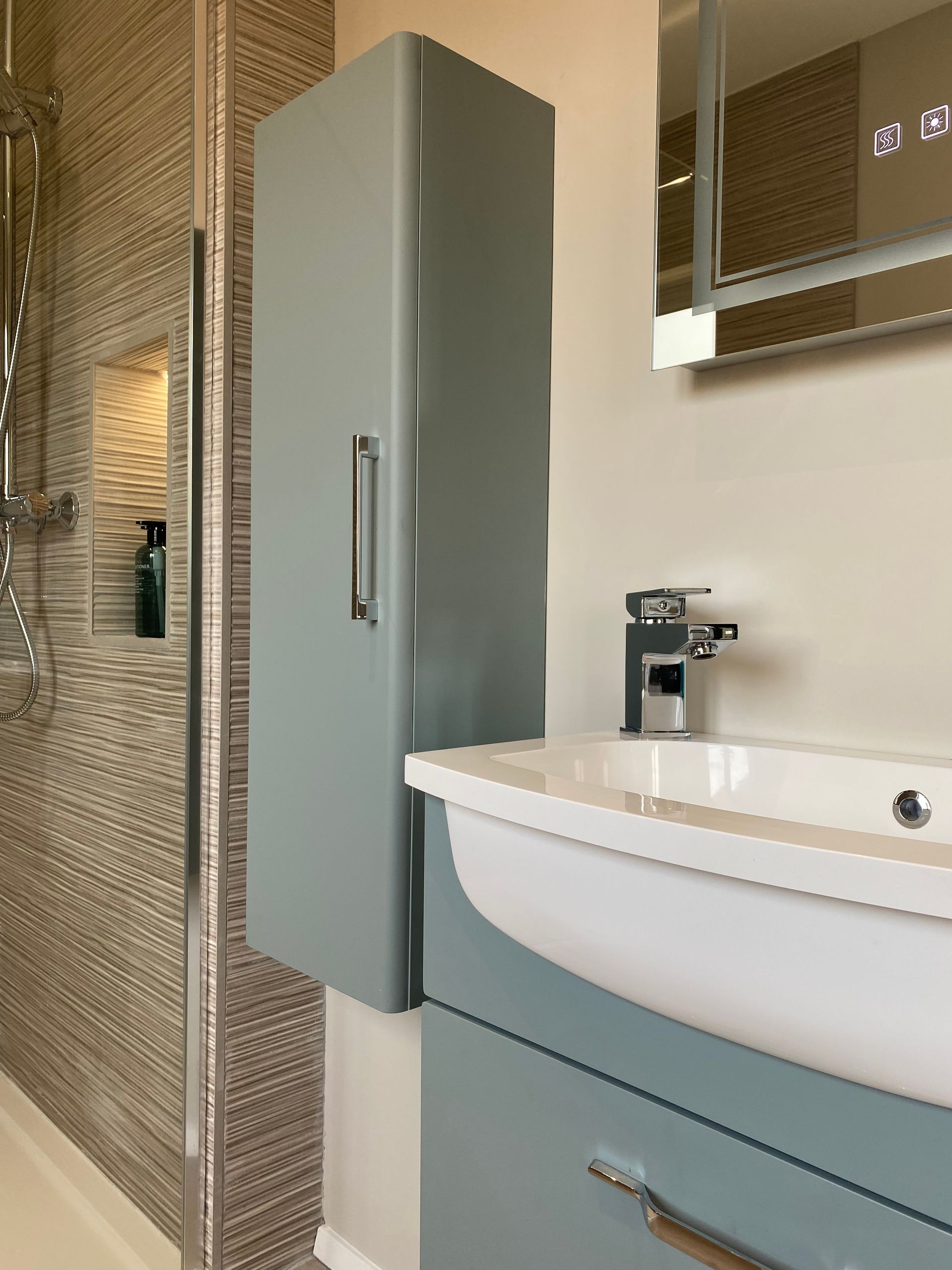 A bathroom with a sink a cabinet and a mirror