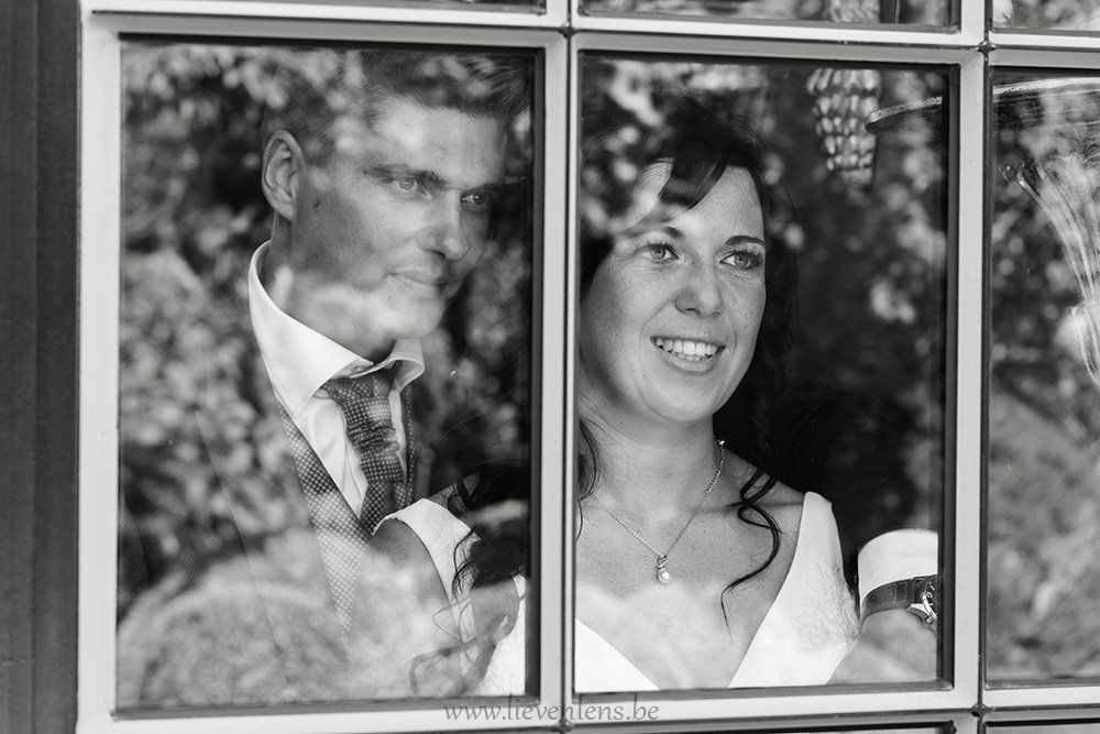 Bride and groom reflection
