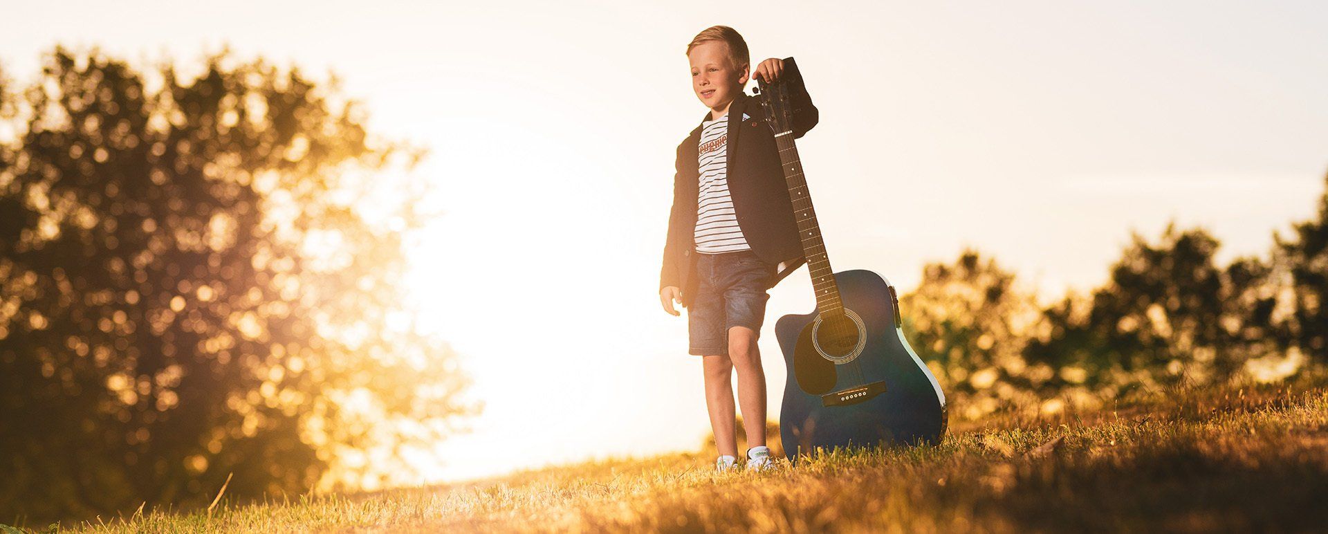 communie jongen voorbeeld gitaar