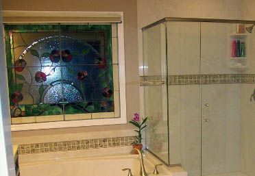bath tub and shower by stained glass window