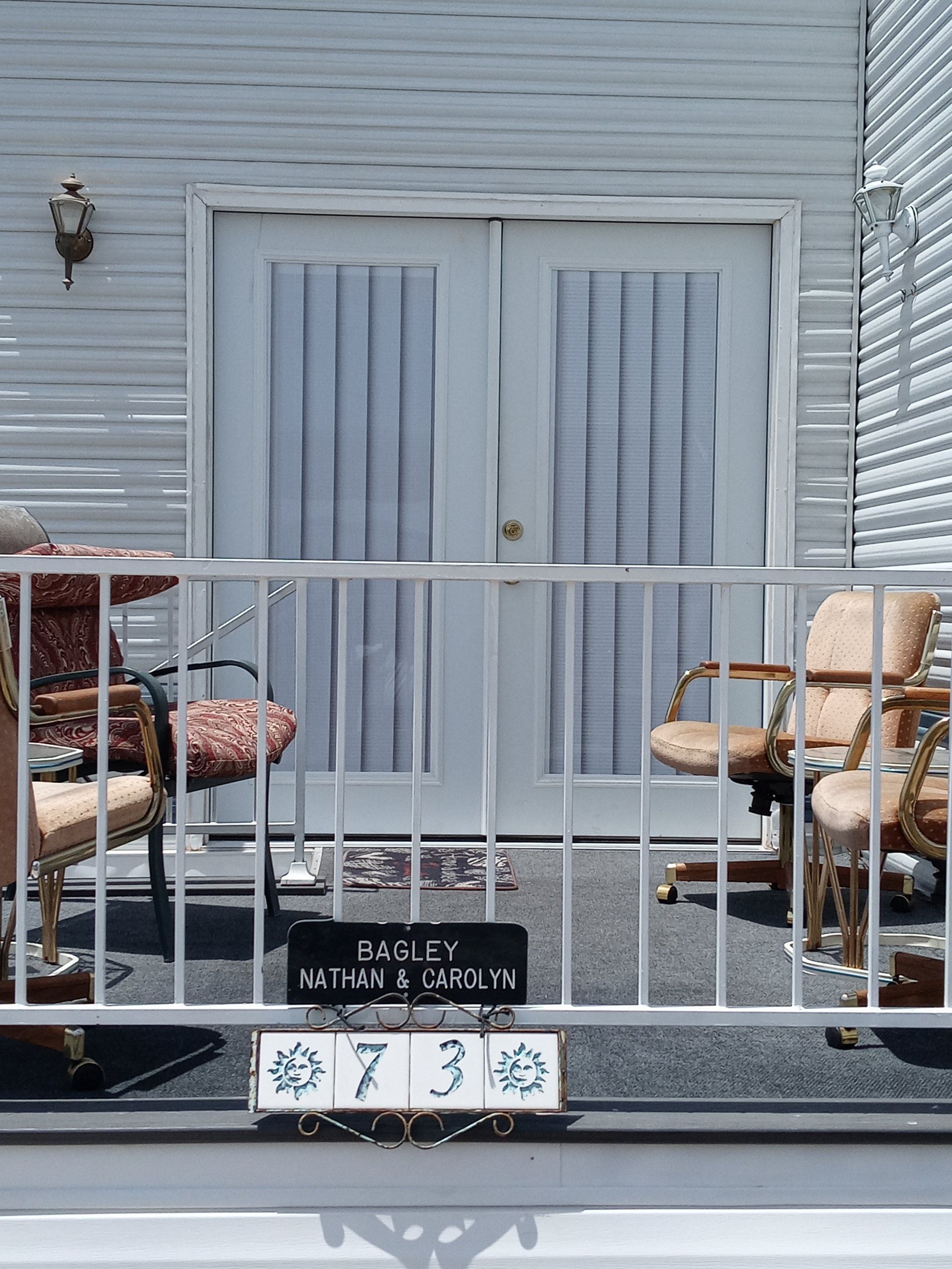 A patio with chairs and a sign that says 0730