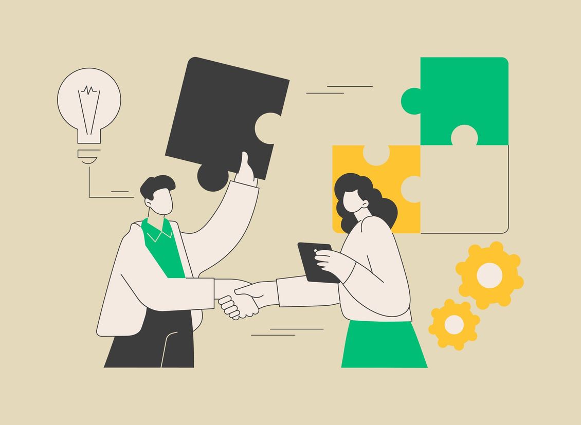 A man and a woman are shaking hands while holding puzzle pieces.