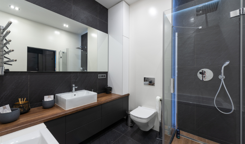 A bathroom with a sink , toilet , bathtub and mirror.