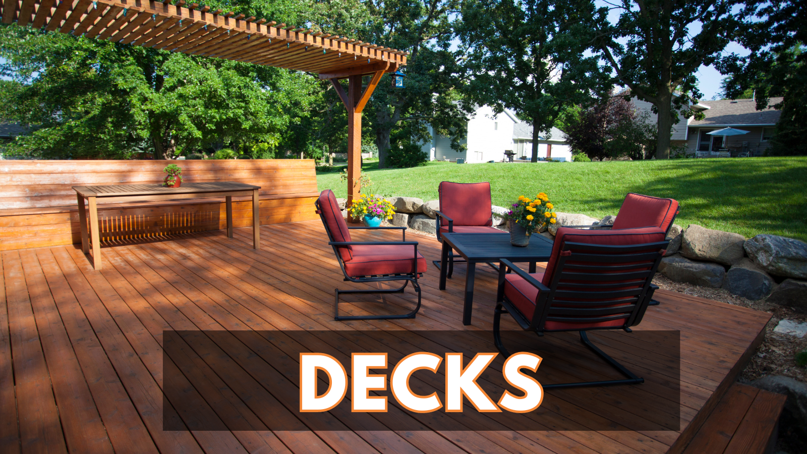 A wooden deck with a table and chairs under a pergola