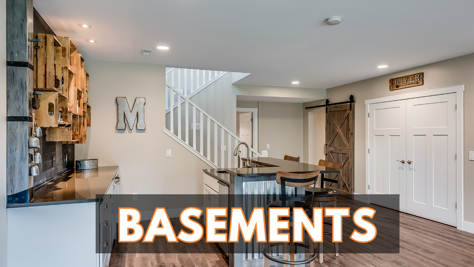 A basement with a kitchen , dining room , and stairs.
