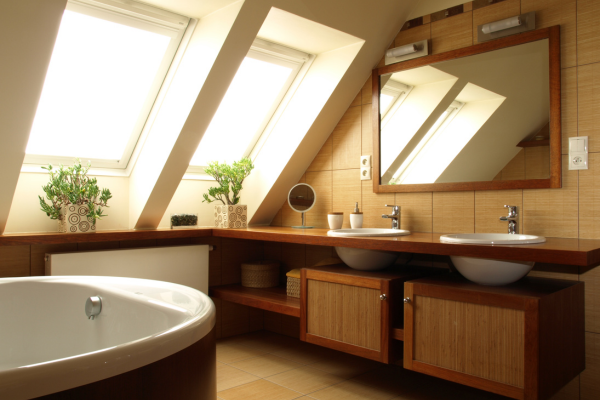 A bathroom with a bathtub and two sinks