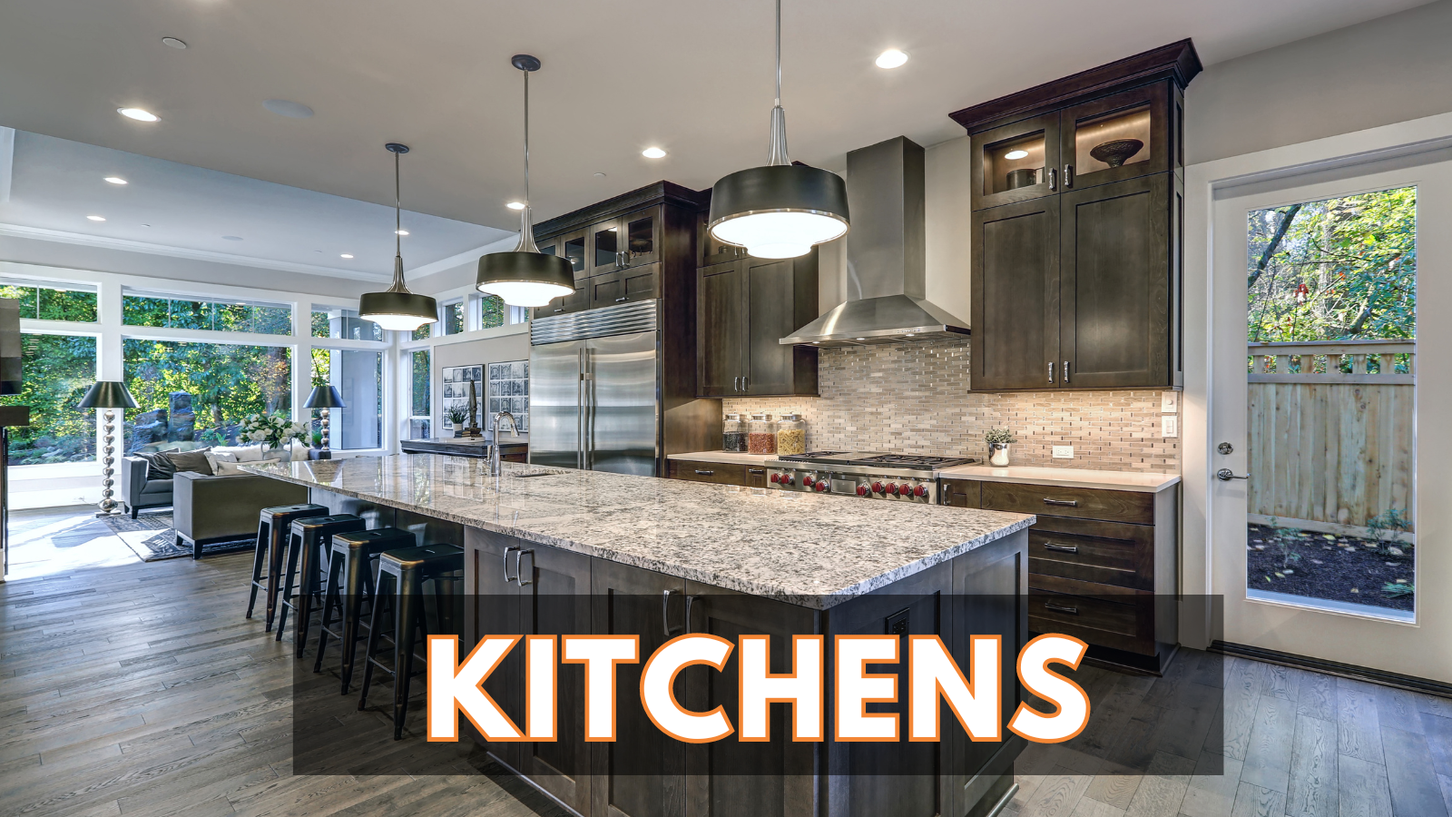 A kitchen with a large island and granite counter tops.