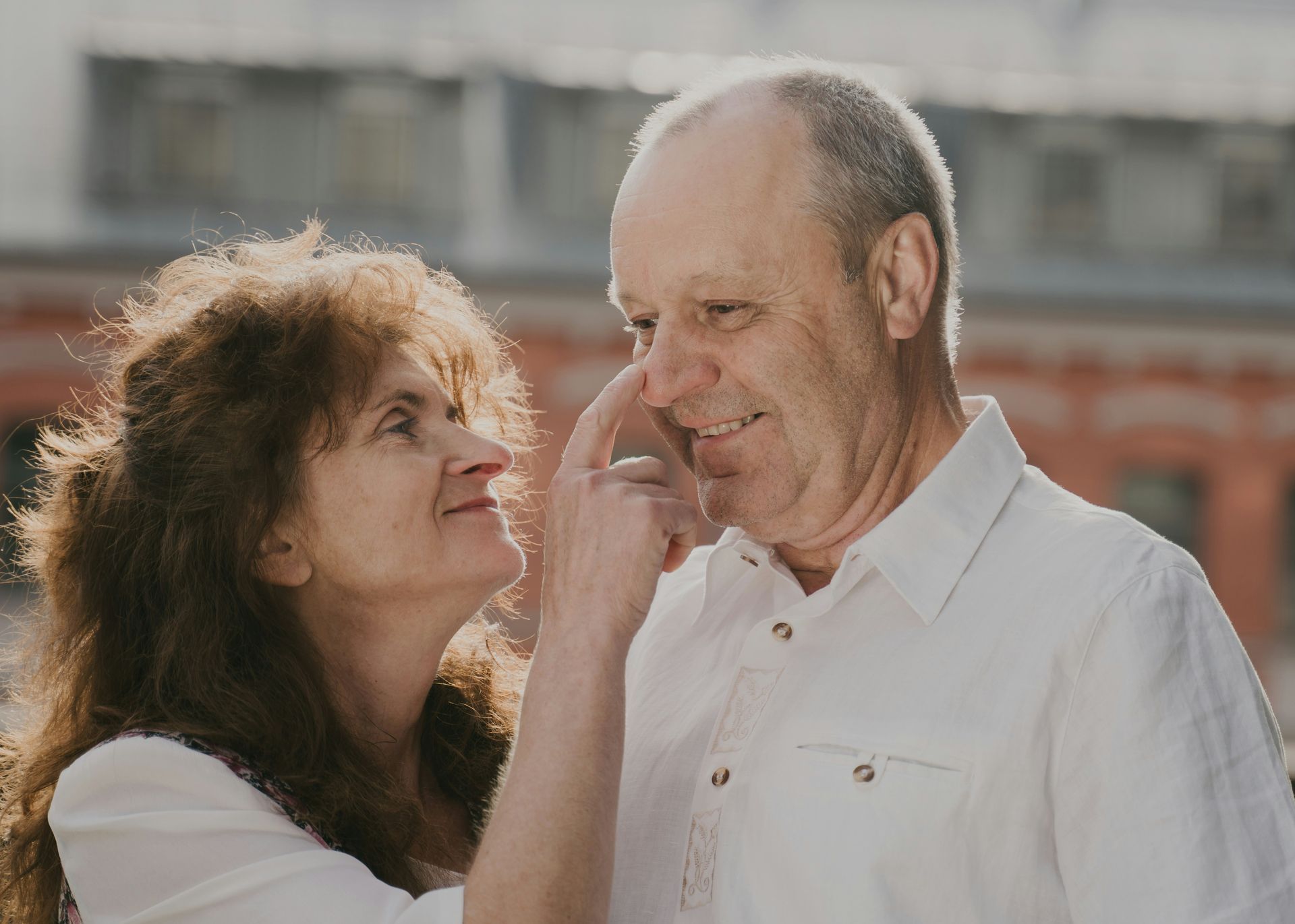 Couple playfully smileing at one another