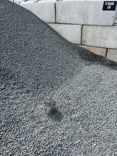 A pile of rocks is sitting on the ground.