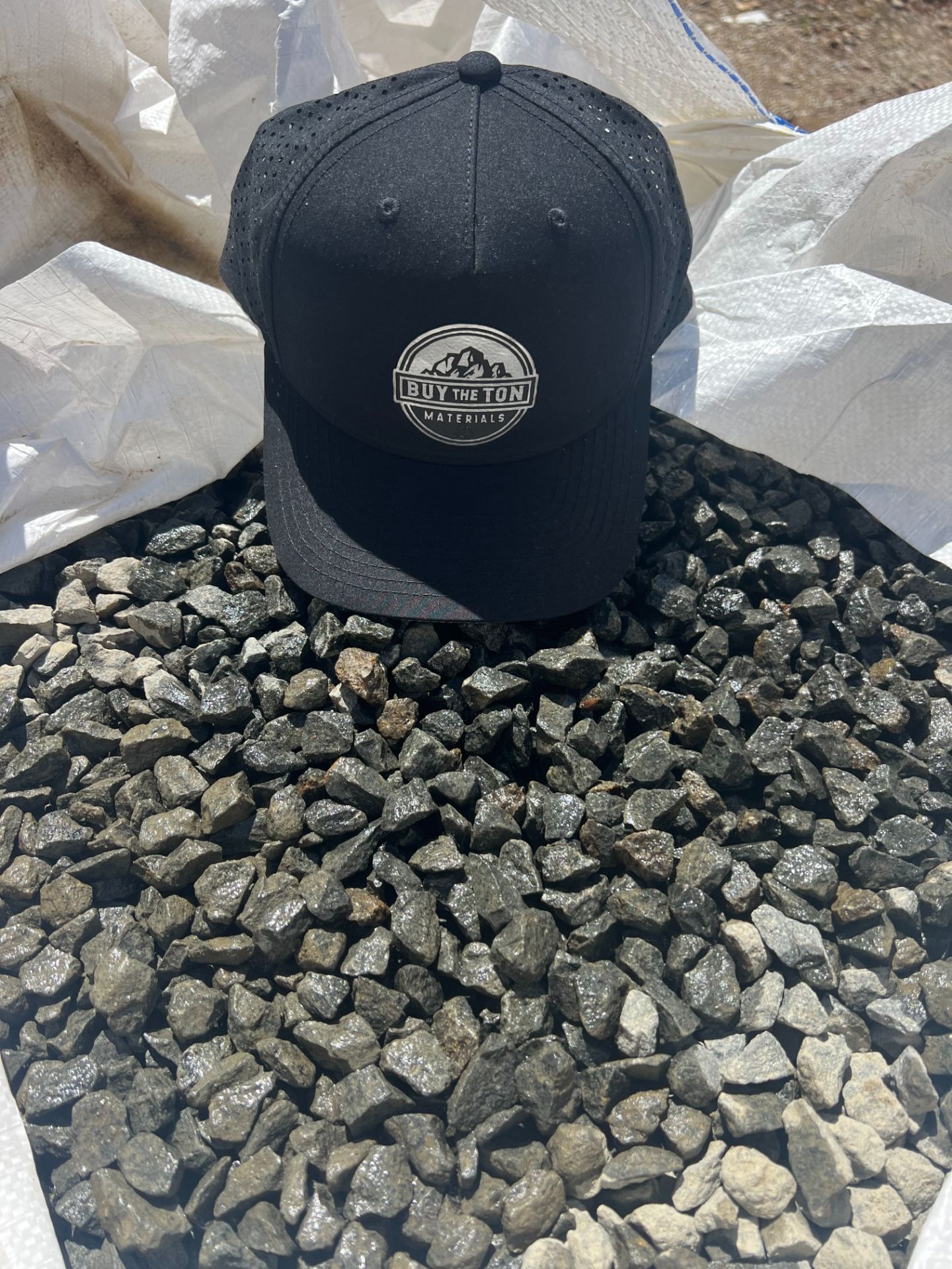 A pile of rocks sitting on top of each other on the ground.
