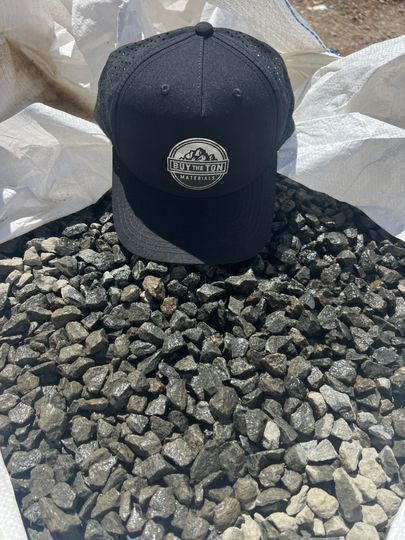 A pile of rocks sitting on top of each other on the ground.