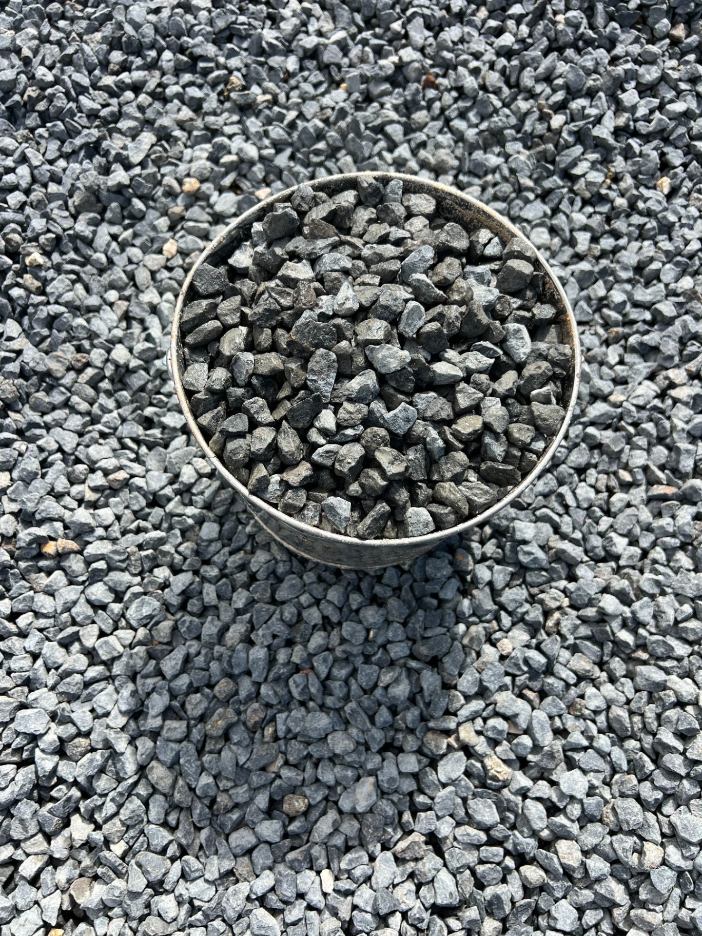 A pile of rocks sitting on top of each other on the ground.