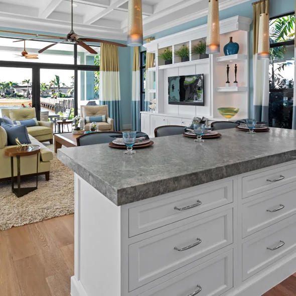 A kitchen with a large island in the middle of it