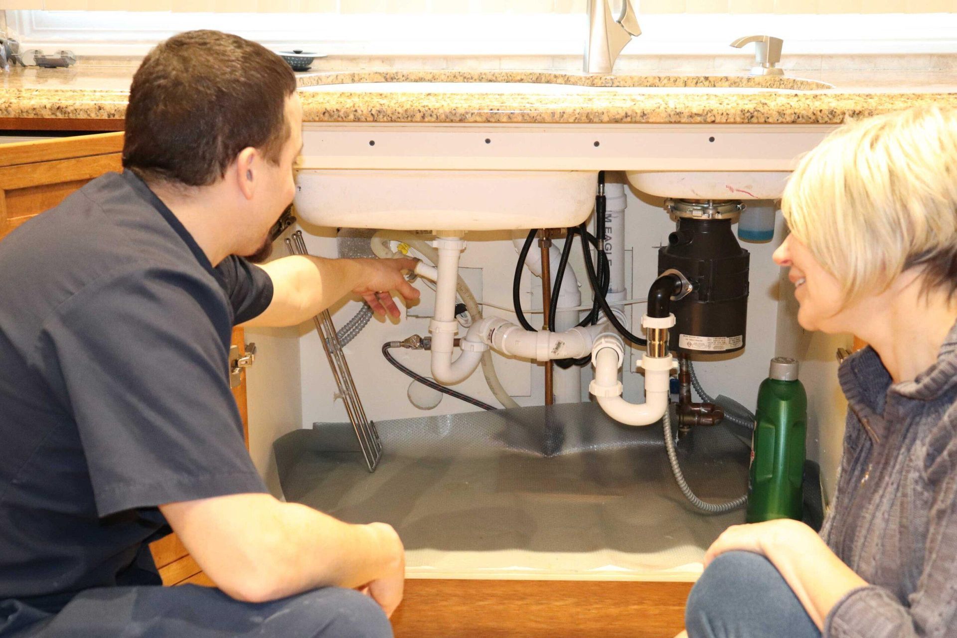 A plumber is fixing a drain problem 