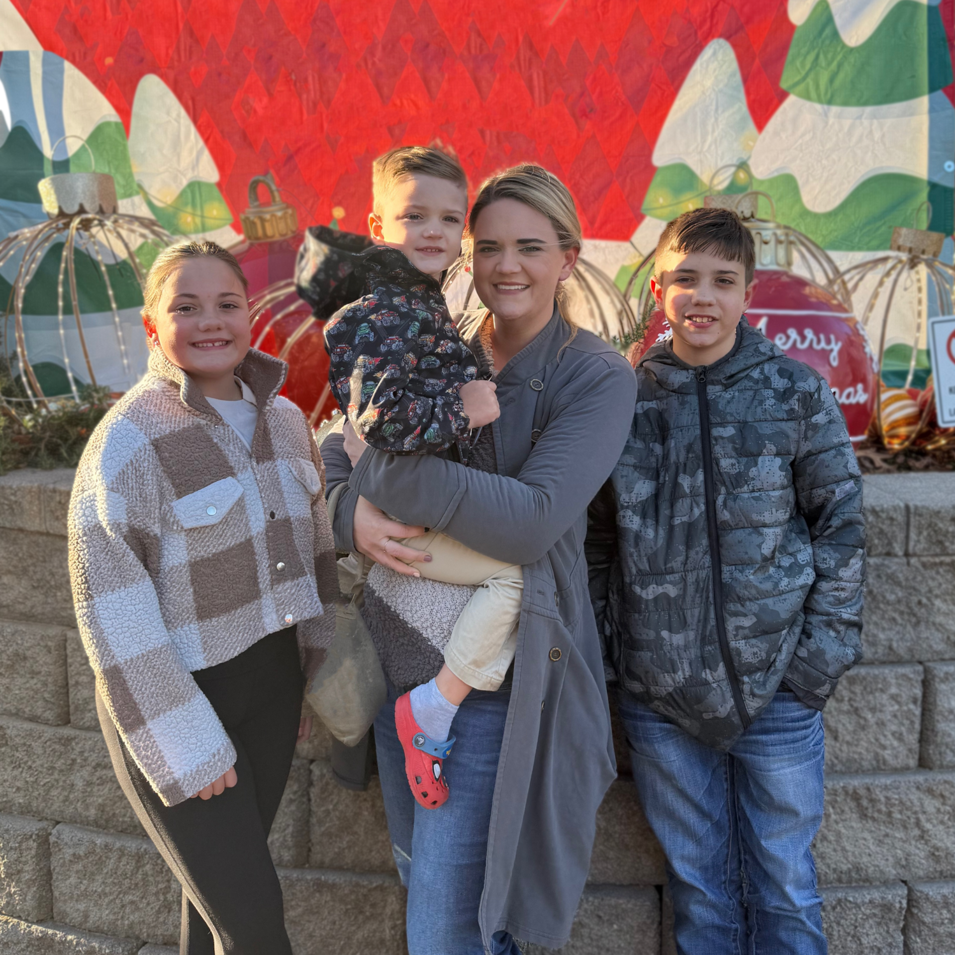 A man and a woman are posing for a picture in front of a building.