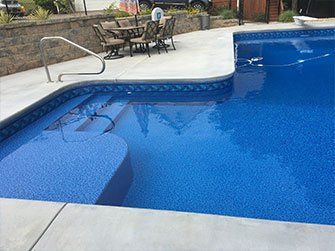 Hardscaping Pools — Swimming Pool With Patio in Monroe, Ga