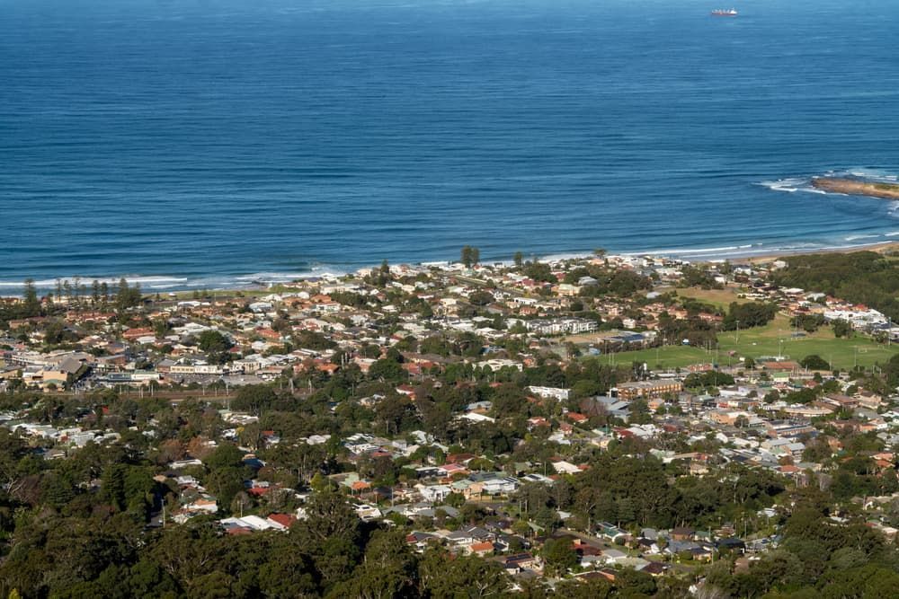 Coastal Town from Above with Blue Ocean — Premier Pest Control Wollongong In Bulli, NSW