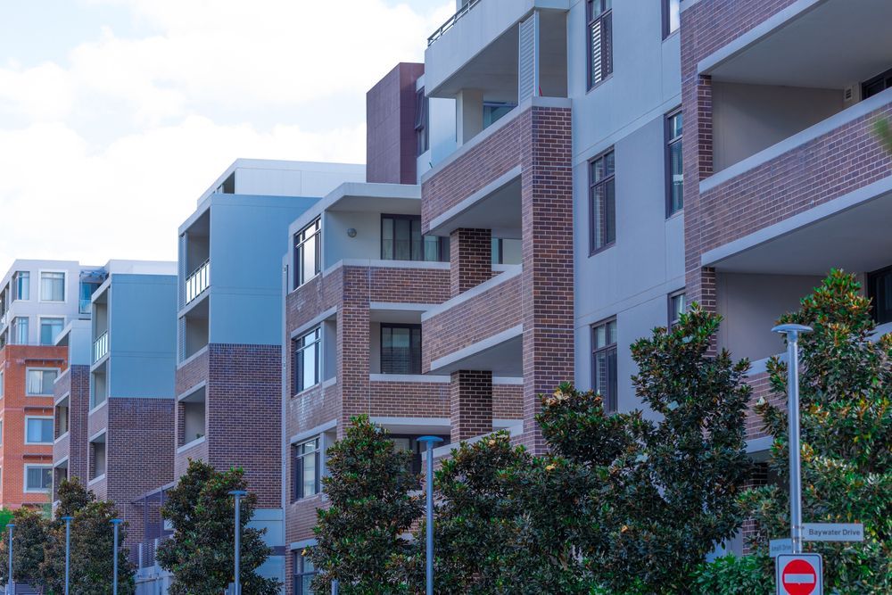 Apartment Buildings With Brick and Light Blue Facades — Premier Pest Control Wollongong In Parramatta, NSW