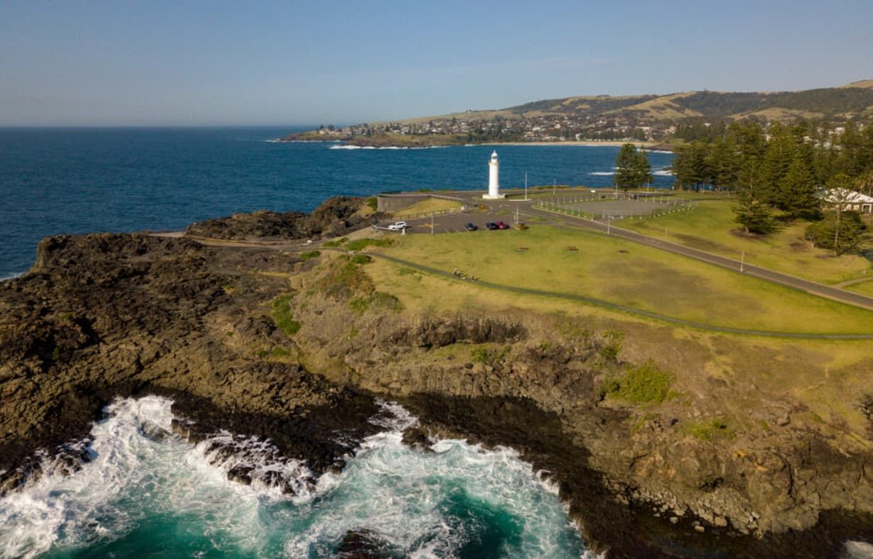 An Aerial View Of A Lighthouse On A Cliff Overlooking The Ocean — Premier Pest Control Wollongong In Kiama, NSW