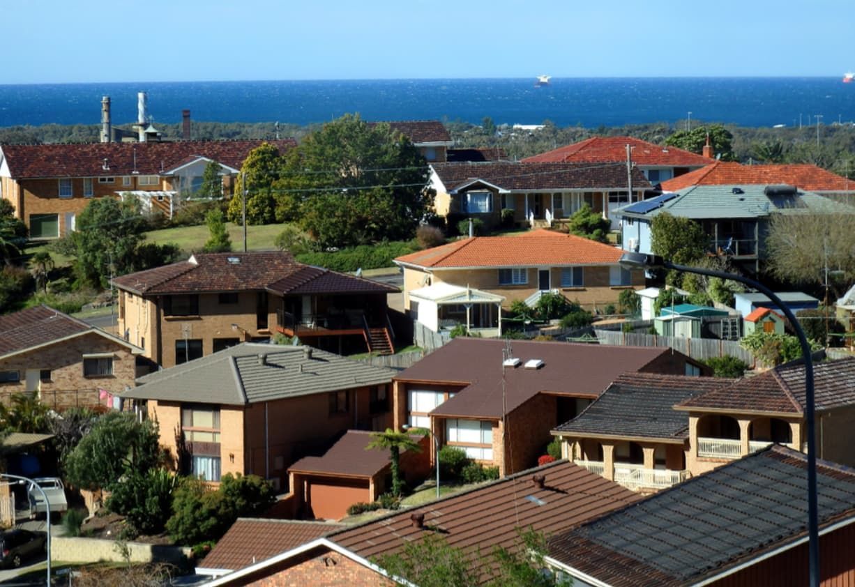 An Aerial View Of A Residential Area With The Ocean In The Background — Premier Pest Control Wollongong In Corrimal, NSW