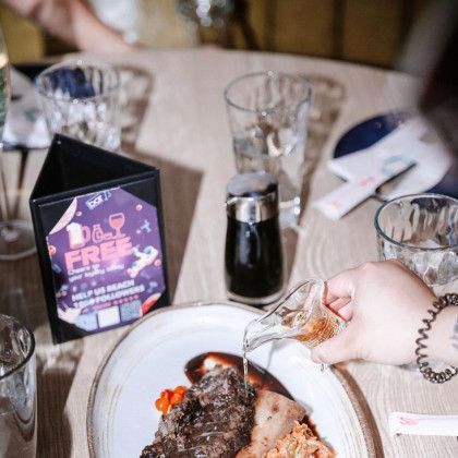 A plate of food on a table with a sign that says free