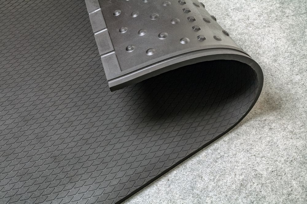 A Close Up Of A Black Rubber Mat On A Gray Surface — NQPT In Garbutt, QLD