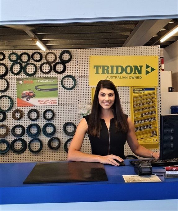 A Sales Counter At An Automotive Or Hardware Store With A Person Standing Behind It — NQPT In Garbutt, QLD