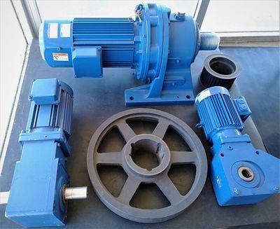 A Group Of Blue Gears And Motors Are Sitting On A Table — NQPT In Garbutt, QLD