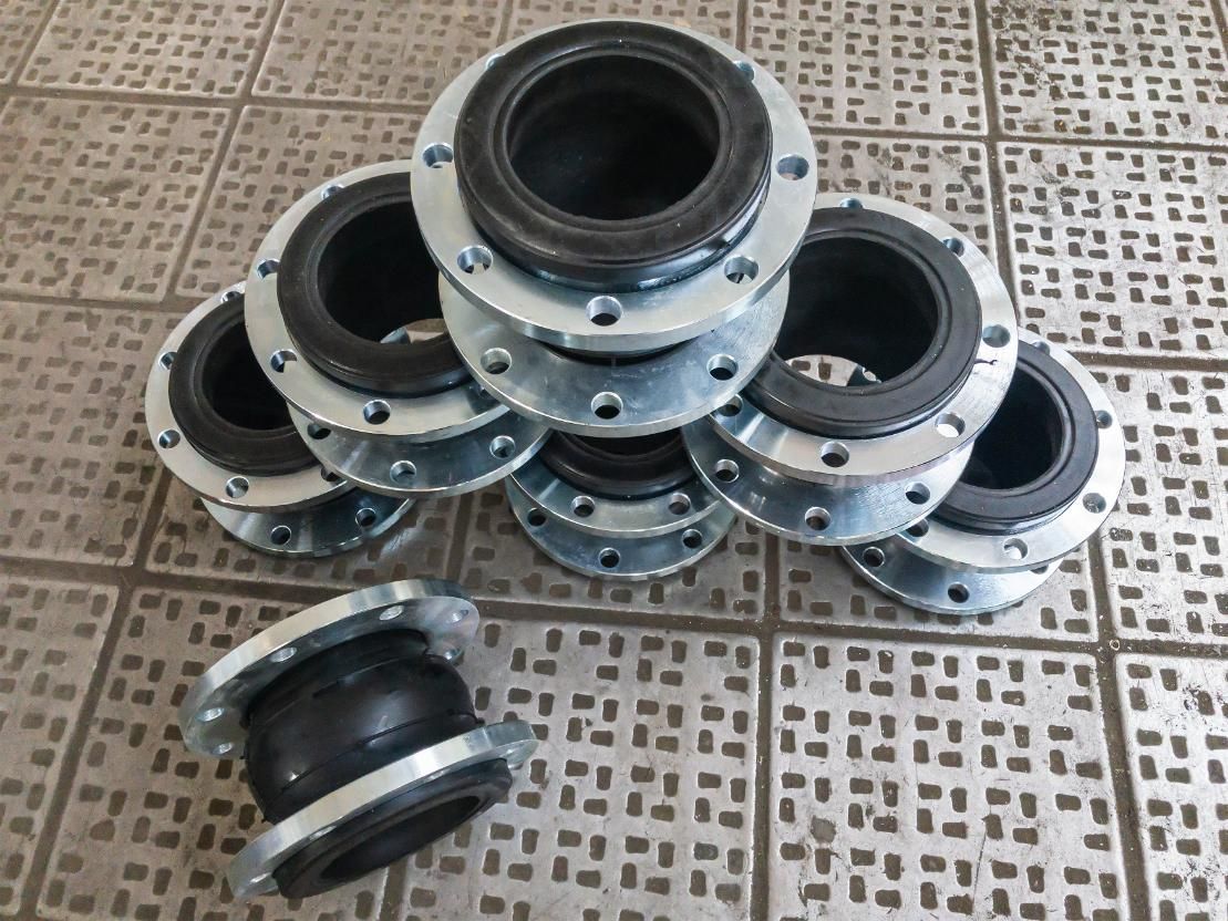 A Bunch Of Rubber Joints Are Stacked On Top Of Each Other On A Tiled Floor — NQPT In Garbutt, QLD