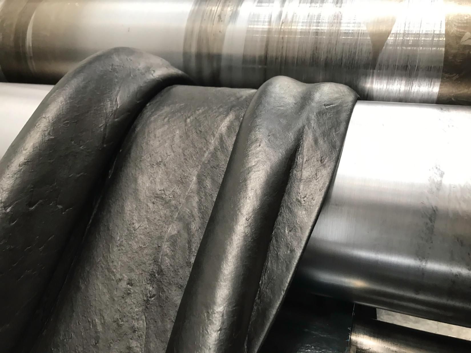 A Close Up Of A Piece Of Black Leather On A Machine — NQPT In Garbutt, QLD