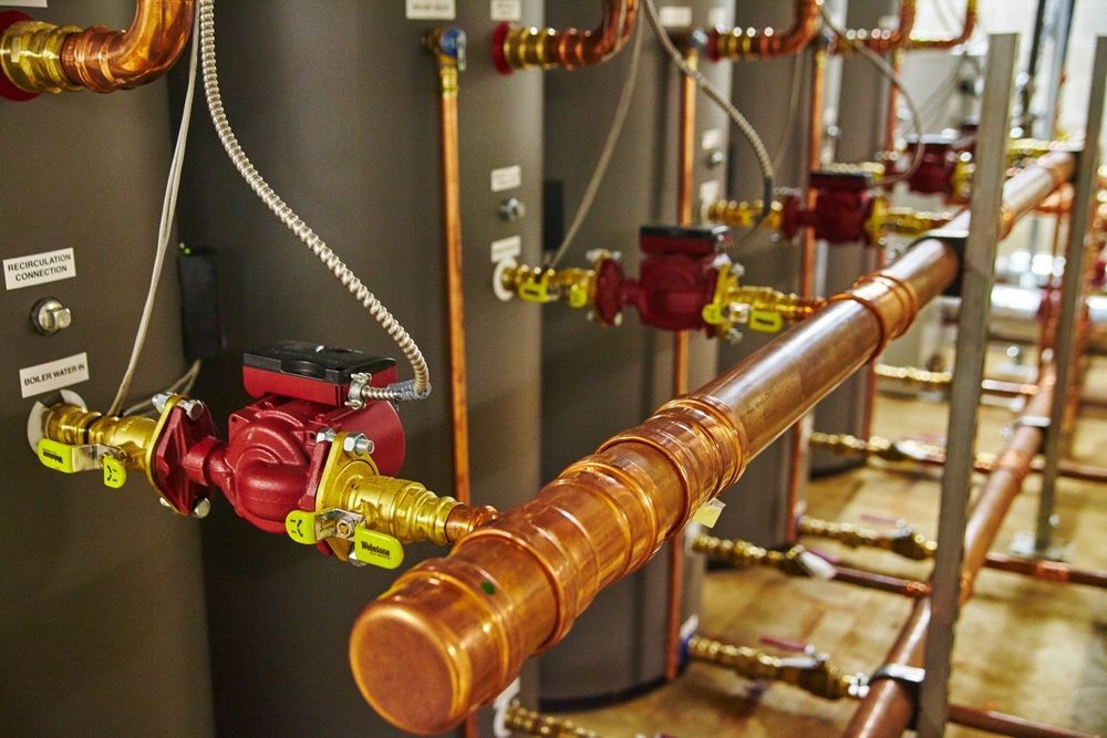 A Bunch Of Hydraulic Hoses Are Stacked On Top Of Each Other On A Table — NQPT In Garbutt, QLD