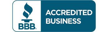 A blue and white badge that says accredited business